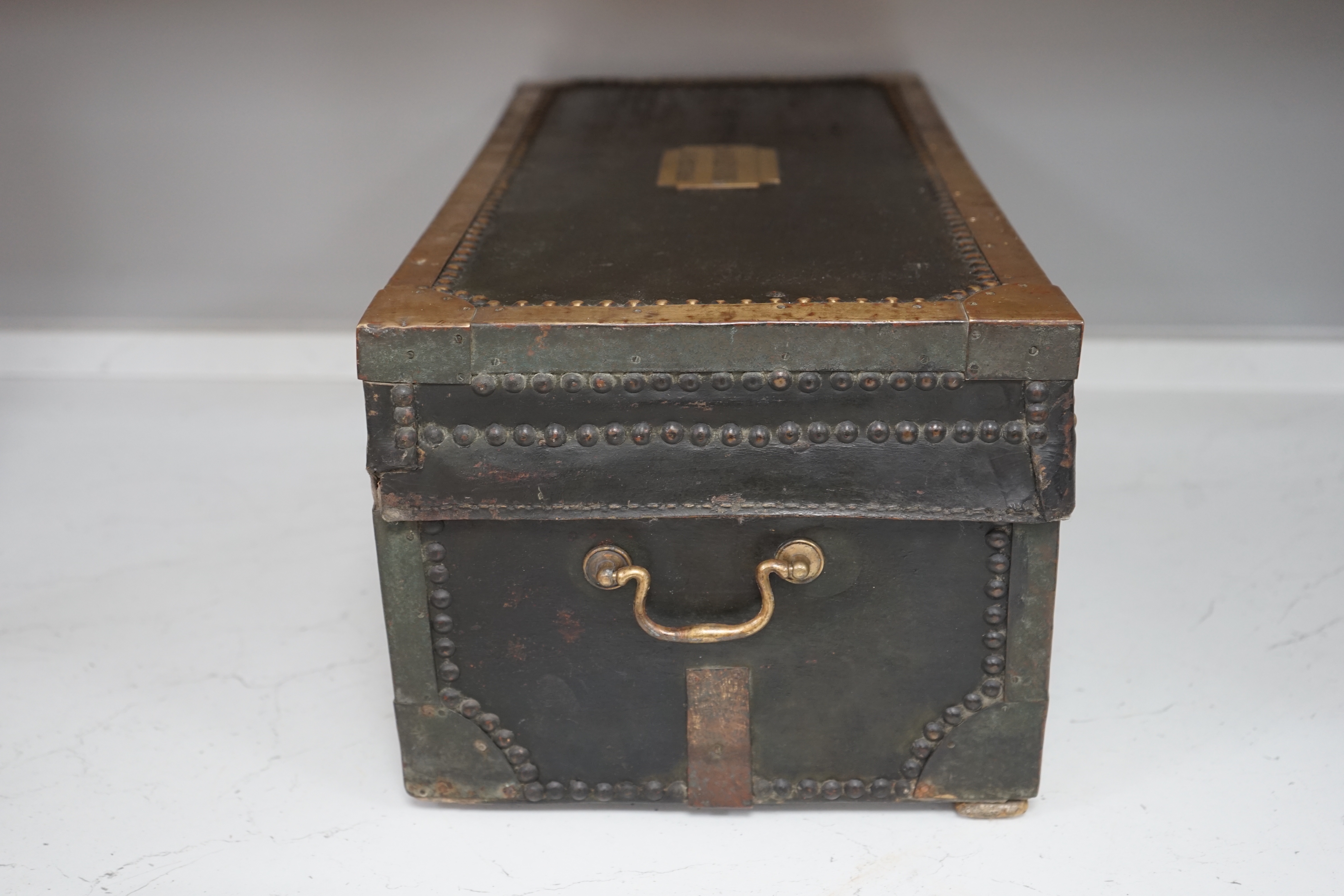 A 19th century leather and brass bound trunk with Avery Ltd applied brass plaque; 'Borough of Brighton', 54cm x 26.5cm x 22cm